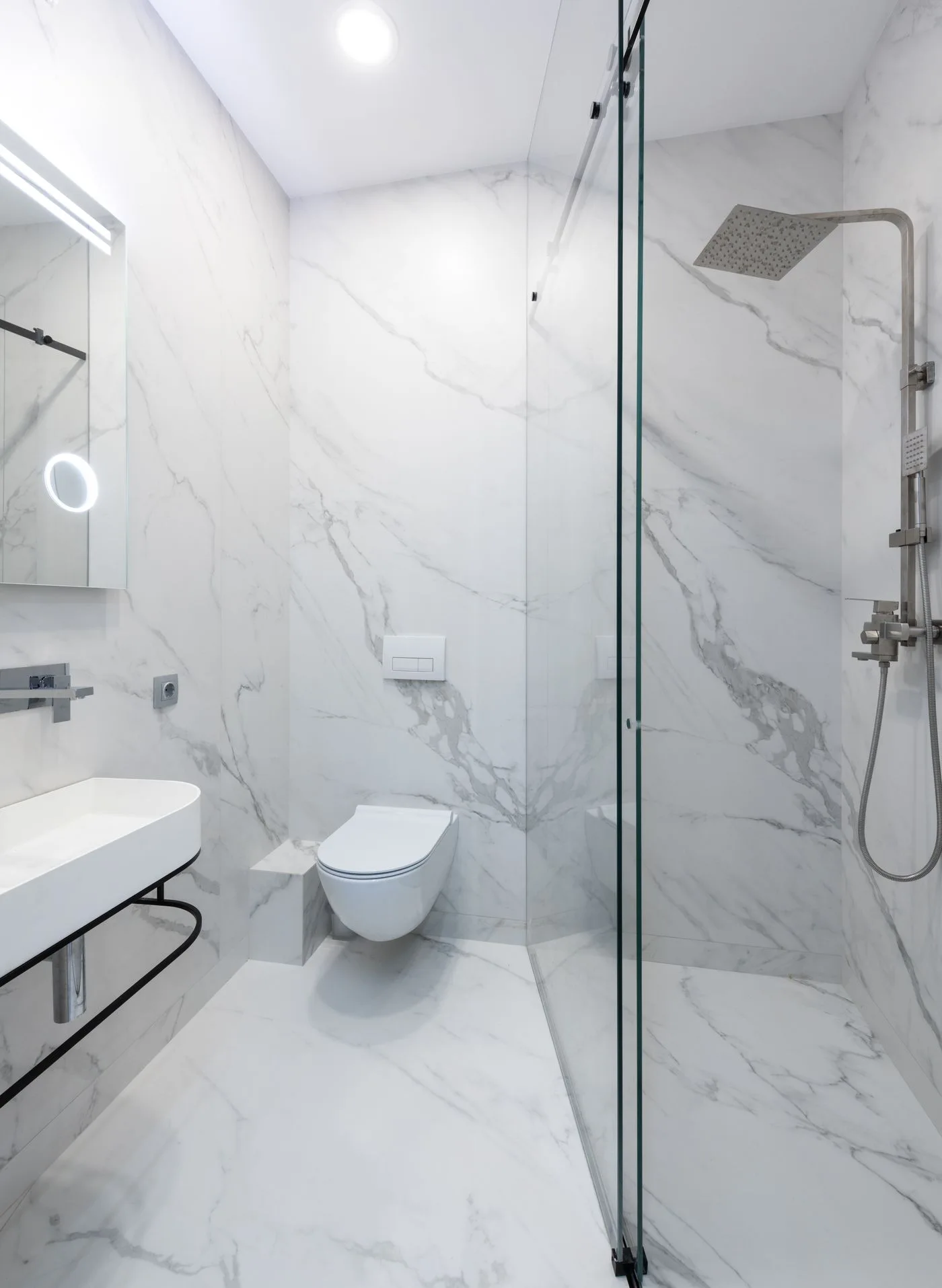 Marble-effect bathroom inspiration with a walk-in shower