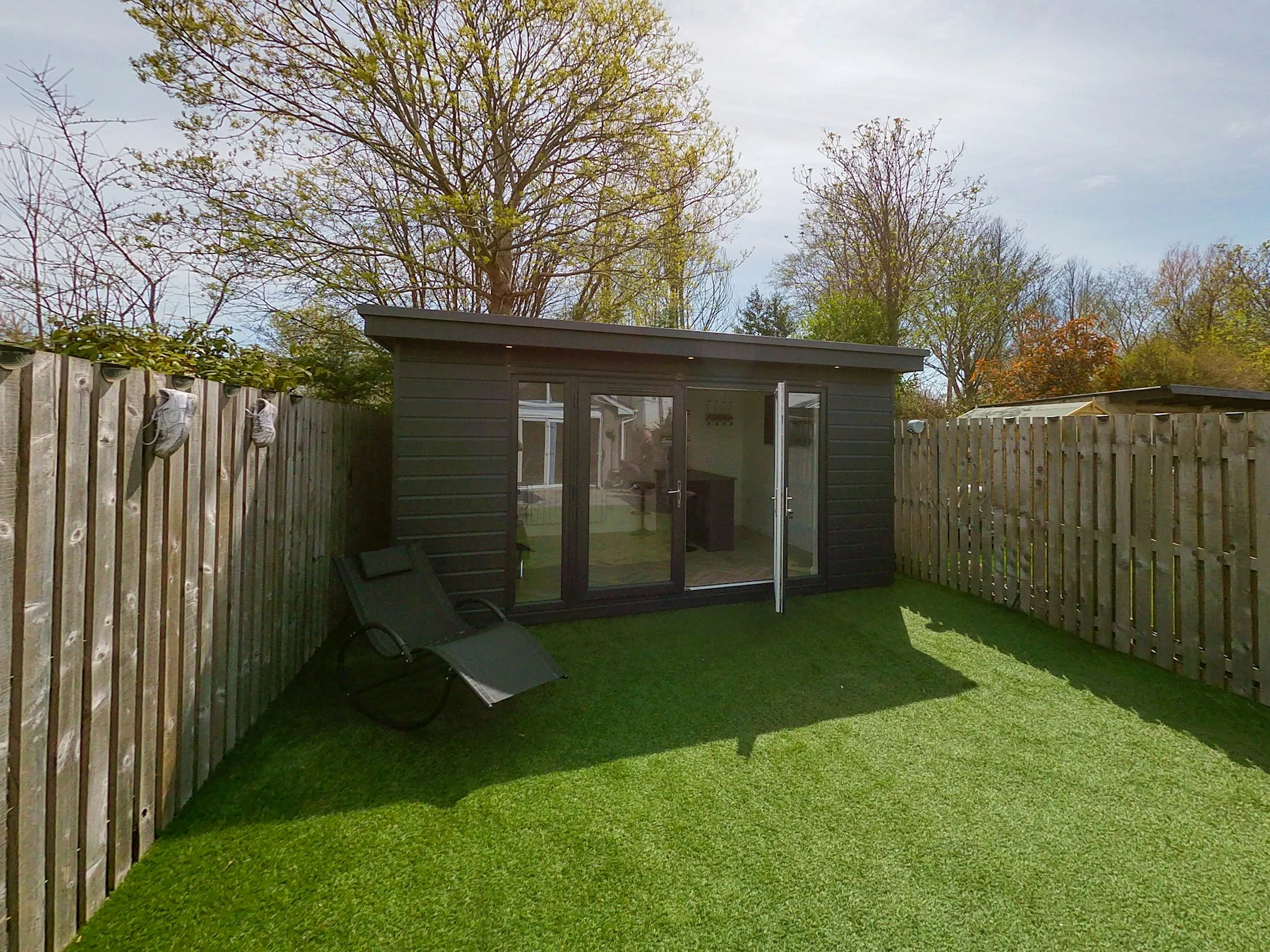 Garden-room exterior inspiration with glazed doors and green surroundings